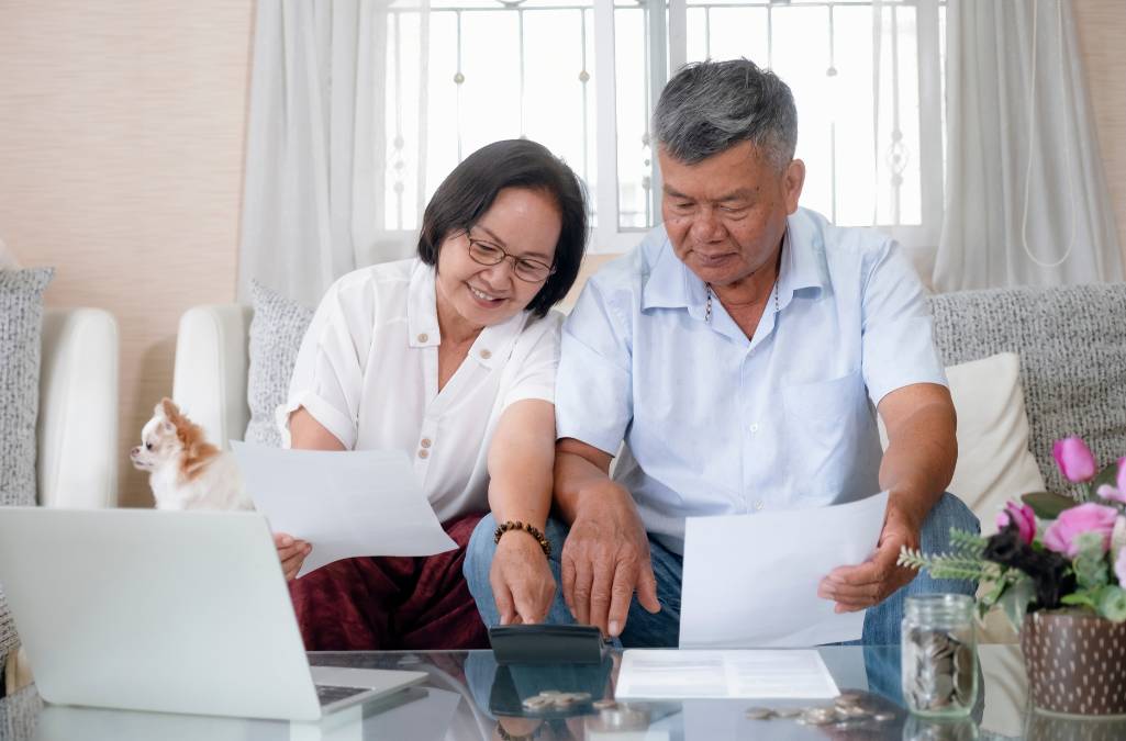 Older couple calculating forms