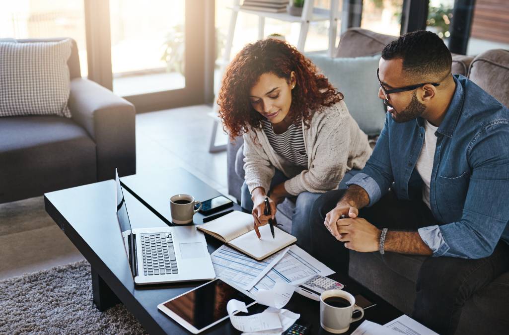 Couple reviewing numbers from forms