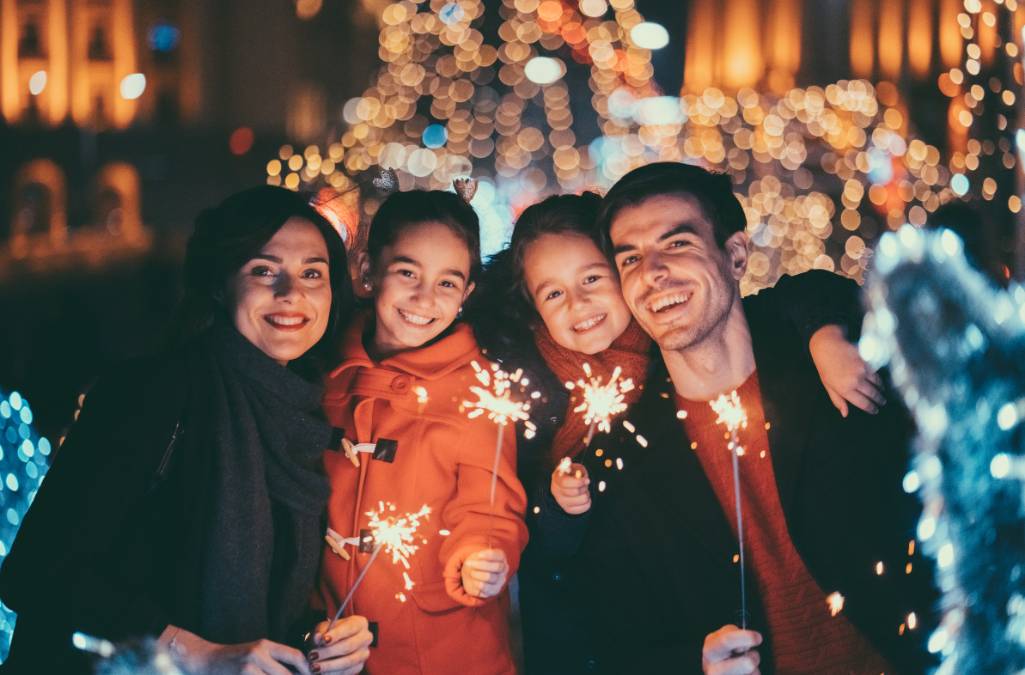 Family holding sparklers